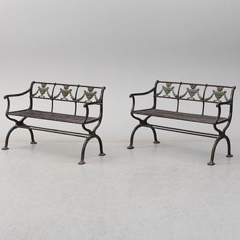 GARDEN SOFAS, a pair, cast iron, empire style, late 19th century.