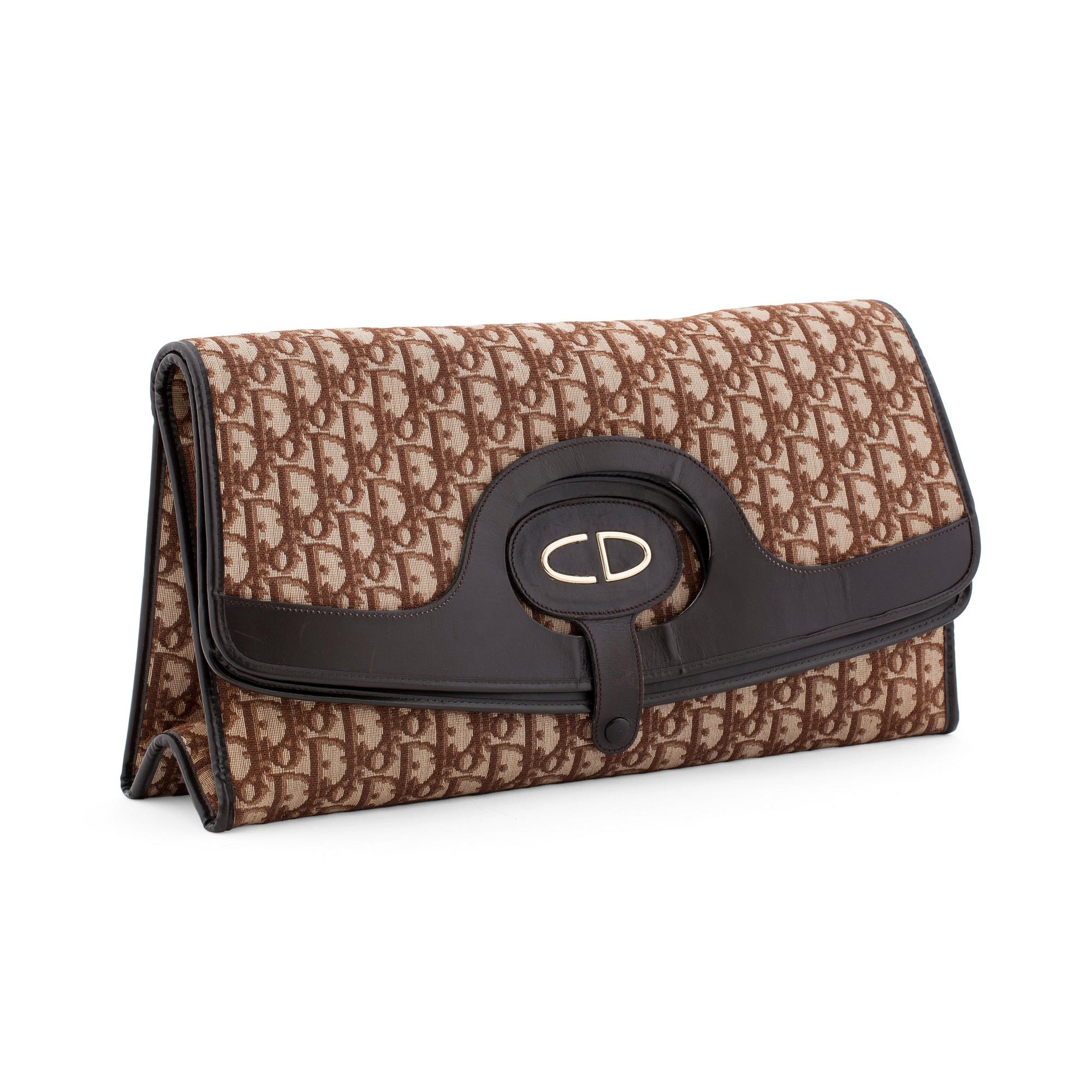 CHRISTIAN DIOR a brown monogram canvas clutch bag. Bukowskis