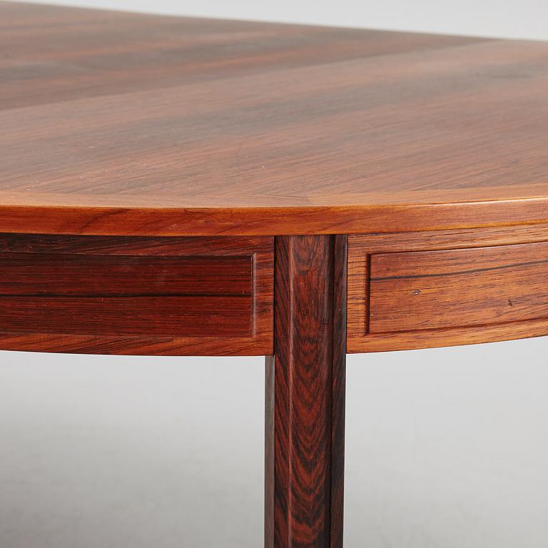 Bertil Fridhagen, a rosewood-veneered dining table with four chairs, BOdsfors, Sweden, 1960's.