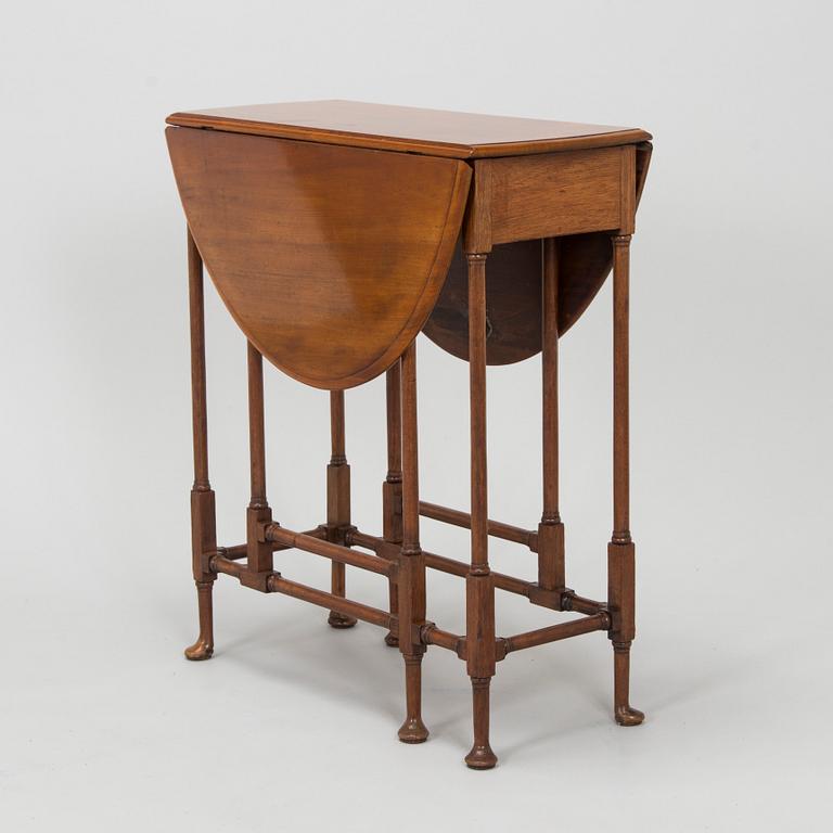 A 20th-century twin-gateleg table, England.