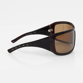 Bottega Veneta, a pair of sunglasses.