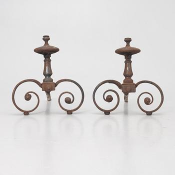A pair of wrought iron fire dogs.