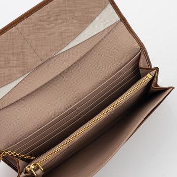 Prada, a brown saffiano wallet.