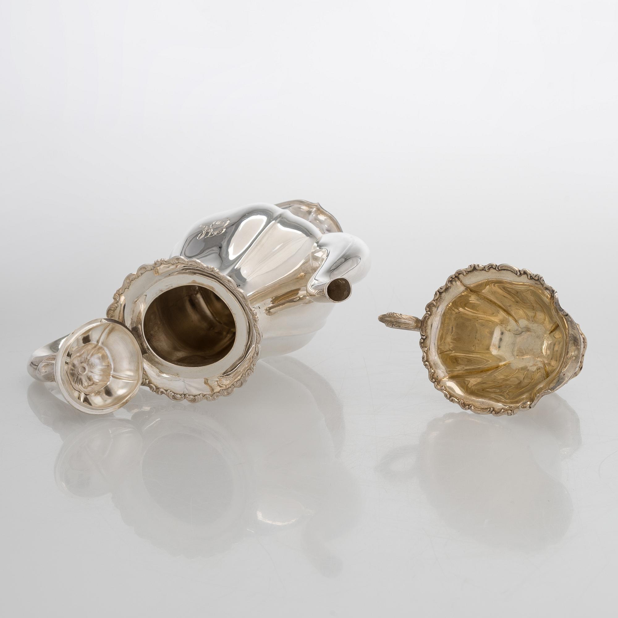 A silver coffee pot, sugar bowl, cream jug, and sugar tongs, Finland 1926-49.