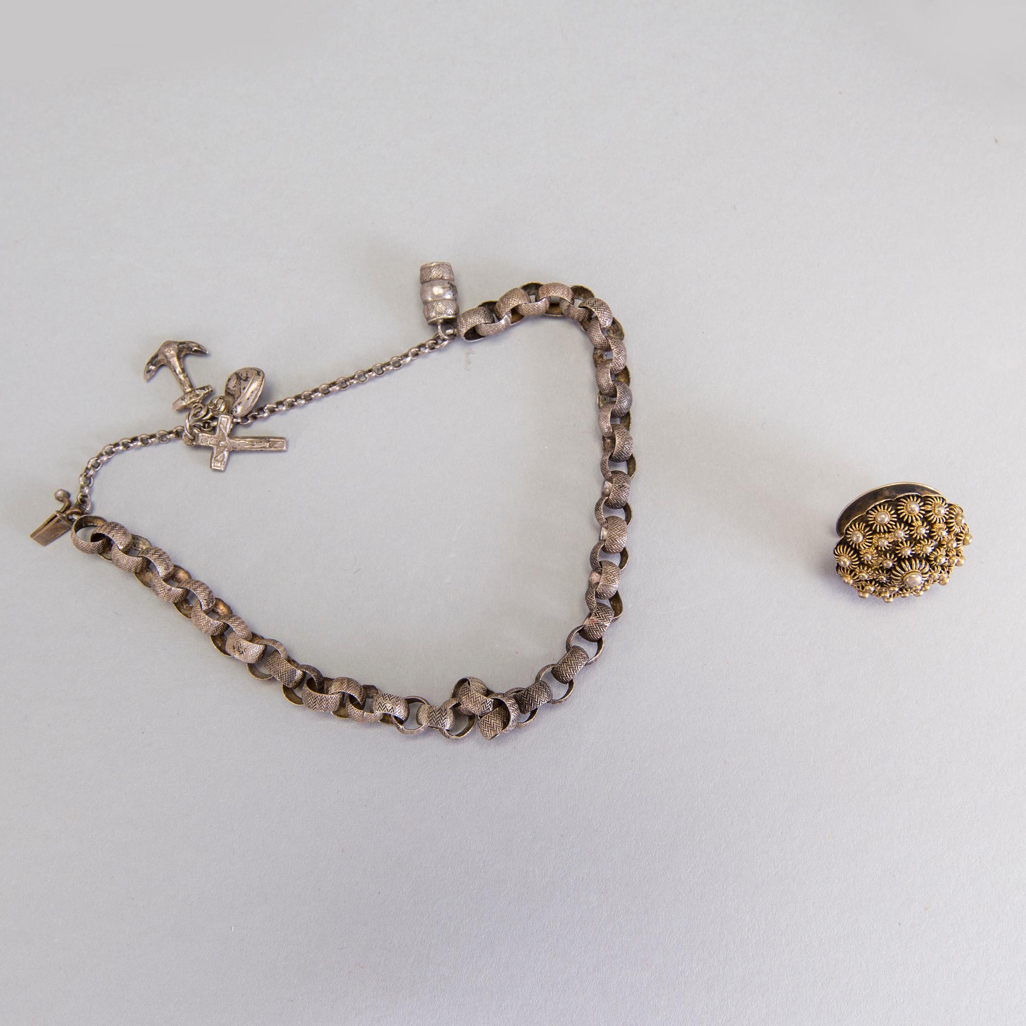 A collection of mostly silver, tradition folk buttons and belt buckles.