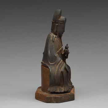 A bronze sculpture of a sitting deity, Ming dynasty (1368-1644).