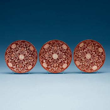 1812. A set of three coral red dishes, Qing dynasty, with Daoguang seal mark.