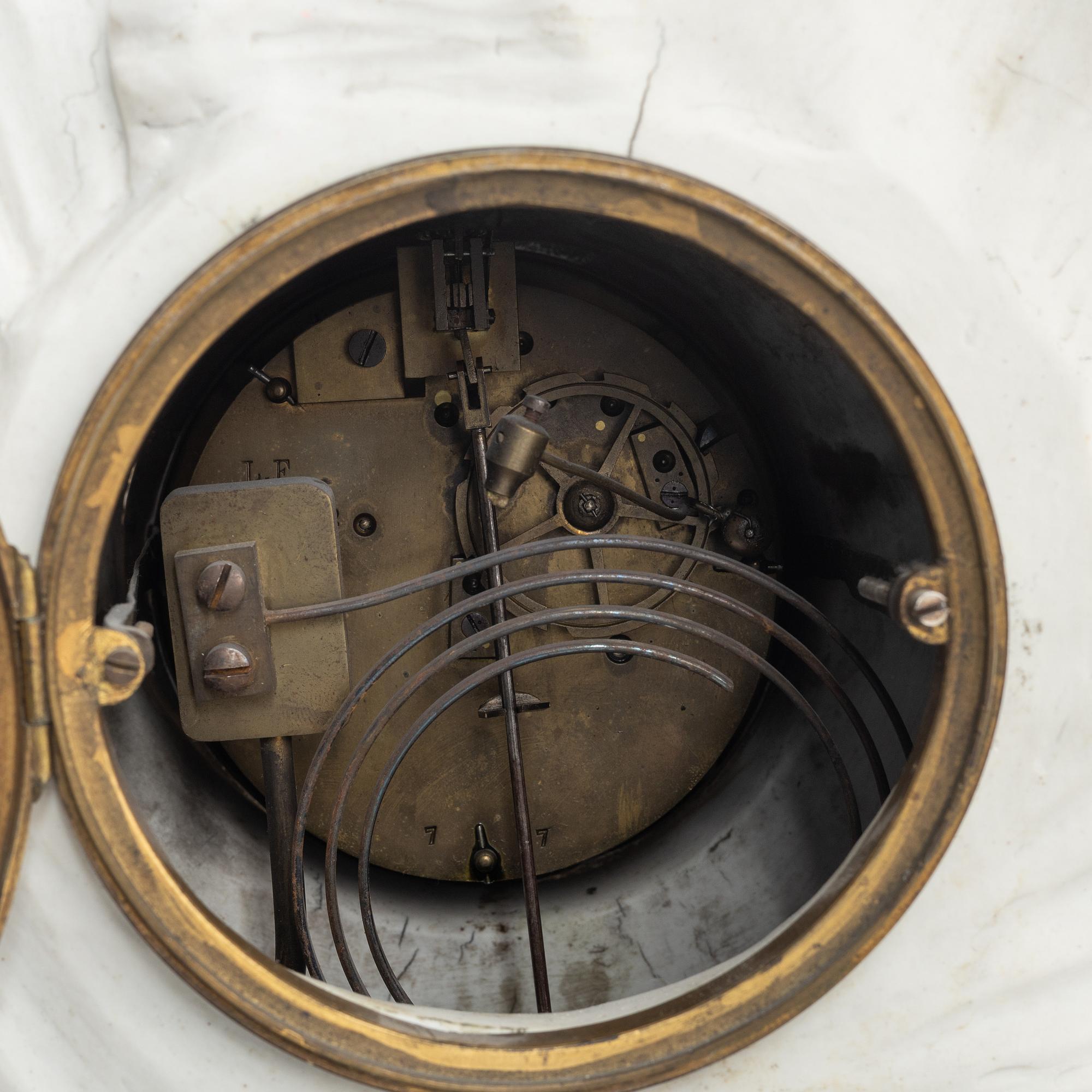 A French Louis XVI bisquit porcelain and ormolu-mounted figural mantel clock, late 18th century.