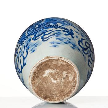 A blue and white Transitional jar with a four clawed dragon, 17th Century.