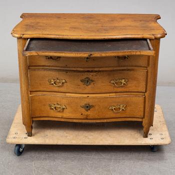 A 18th century rococo chest of drawers.