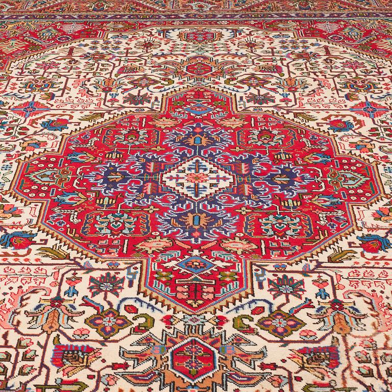 A carpet from Tabriz, around 388 x 294 cm.