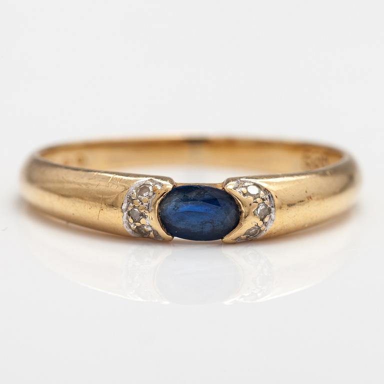 SORMUS, 14K kultaa, safiiri, timantteja n. 0.015 ct yht. Kultakeskus, Hämeenlinna 1999.