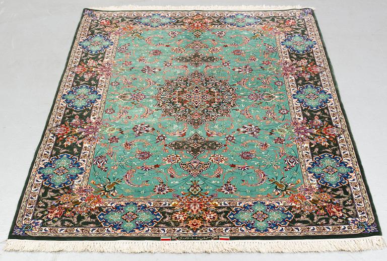 A rug, old Esfahan, part silk, signed, ca 225 x 149 cm (ca 1,5-2,5 cm flat weave at the ends).