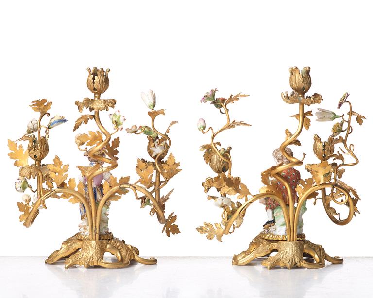 A pair of Meissen Rococo-style three-light candelabra, second half of the 1800's.