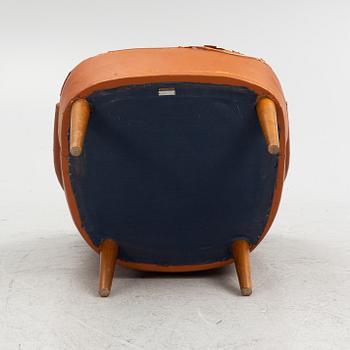 Carl Malmsten, A leather upholstered armchair, model "Lillasyster", O.H. Sjögren, second half of the 20th century.