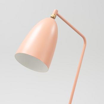 A 'Grasshopper' floorlamp by Greta Magnusson Grossman for Gubi.