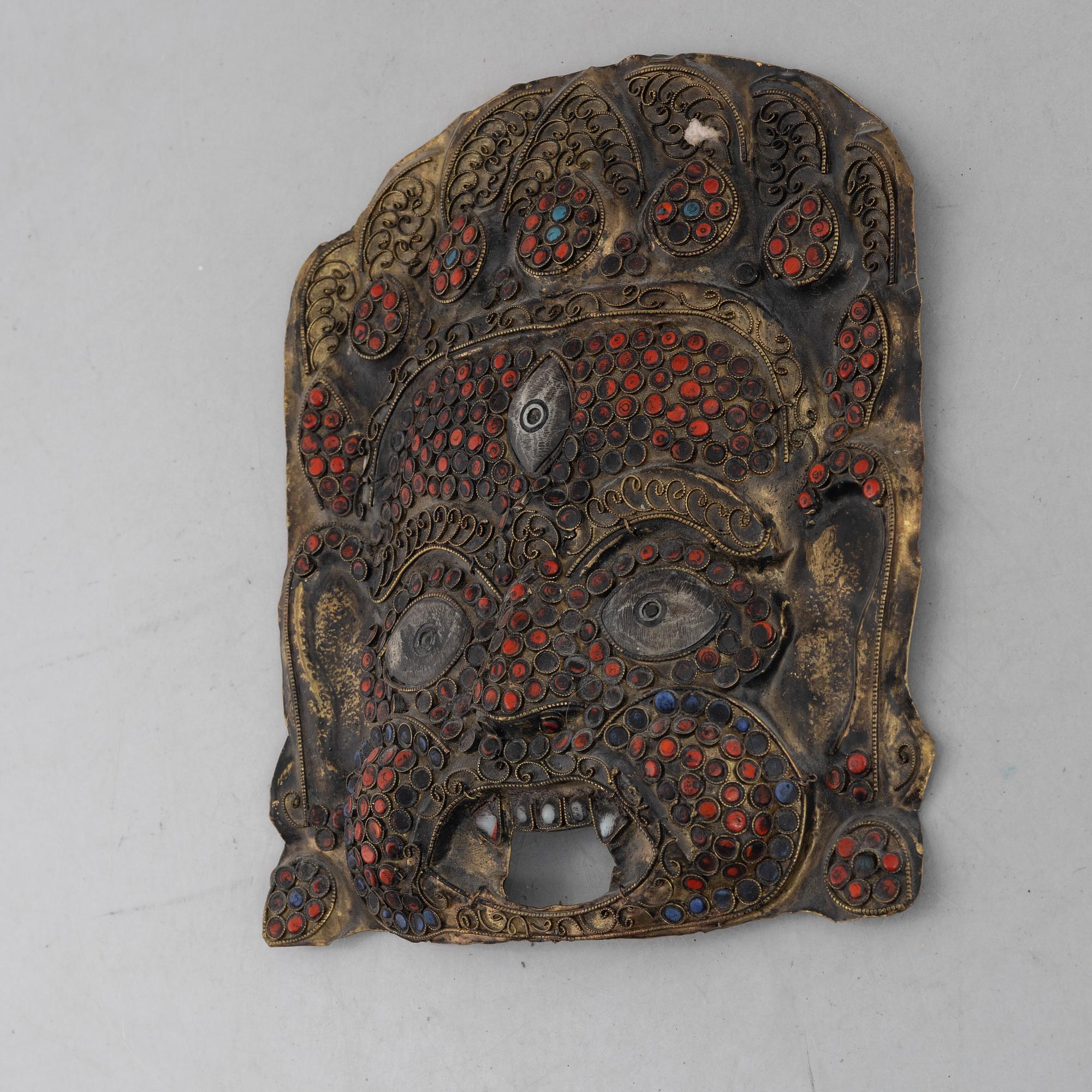 A stone inlay mask, Nepal, early 20th century.