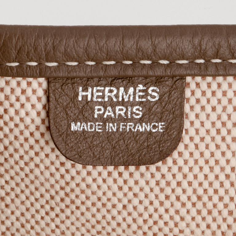 HERMÈS, a canvas and grey leather crossbody bag, "Evelyn".