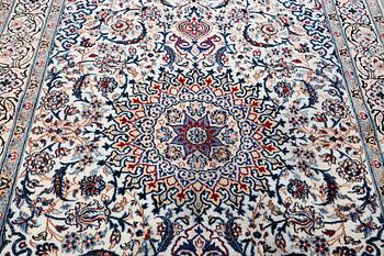 A Nain carpet, part silk, 9 laa, c. 293 x 199 cm.