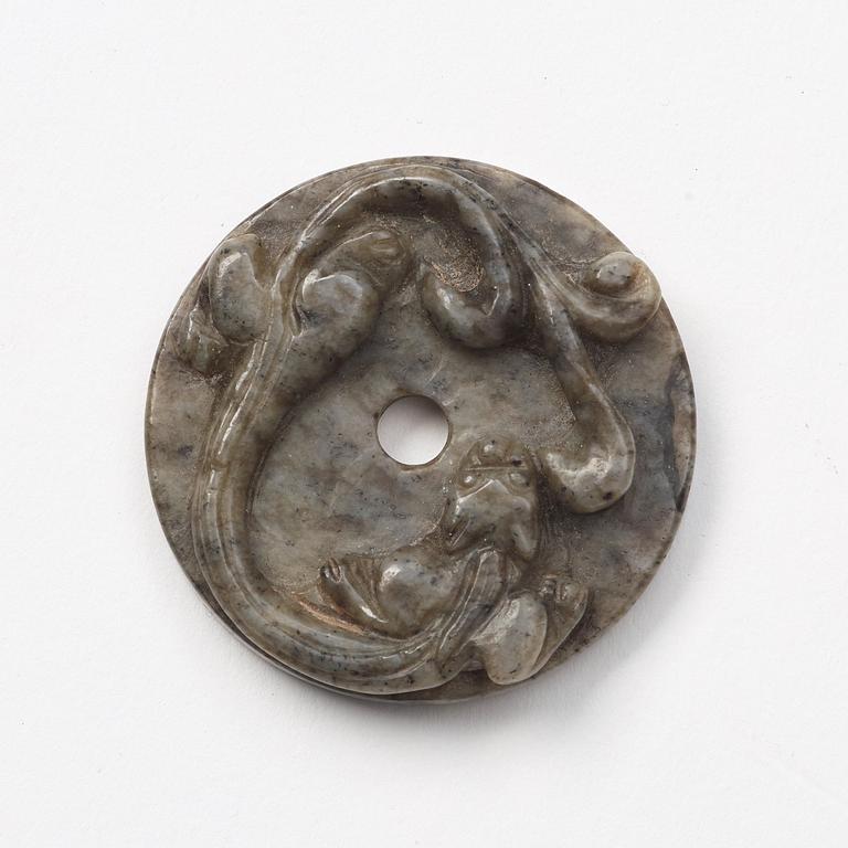 A group of three archaistic Chinese stone bi discs and two pendants.
