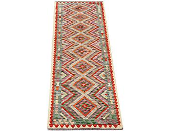 A runner carpet, Kilim, c. 298 x 79 cm.