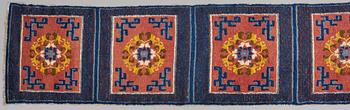 A MEDITATION CARPET, ten squares, a semi-antique Ningxia, China, ca 598,5 x 62 cm.