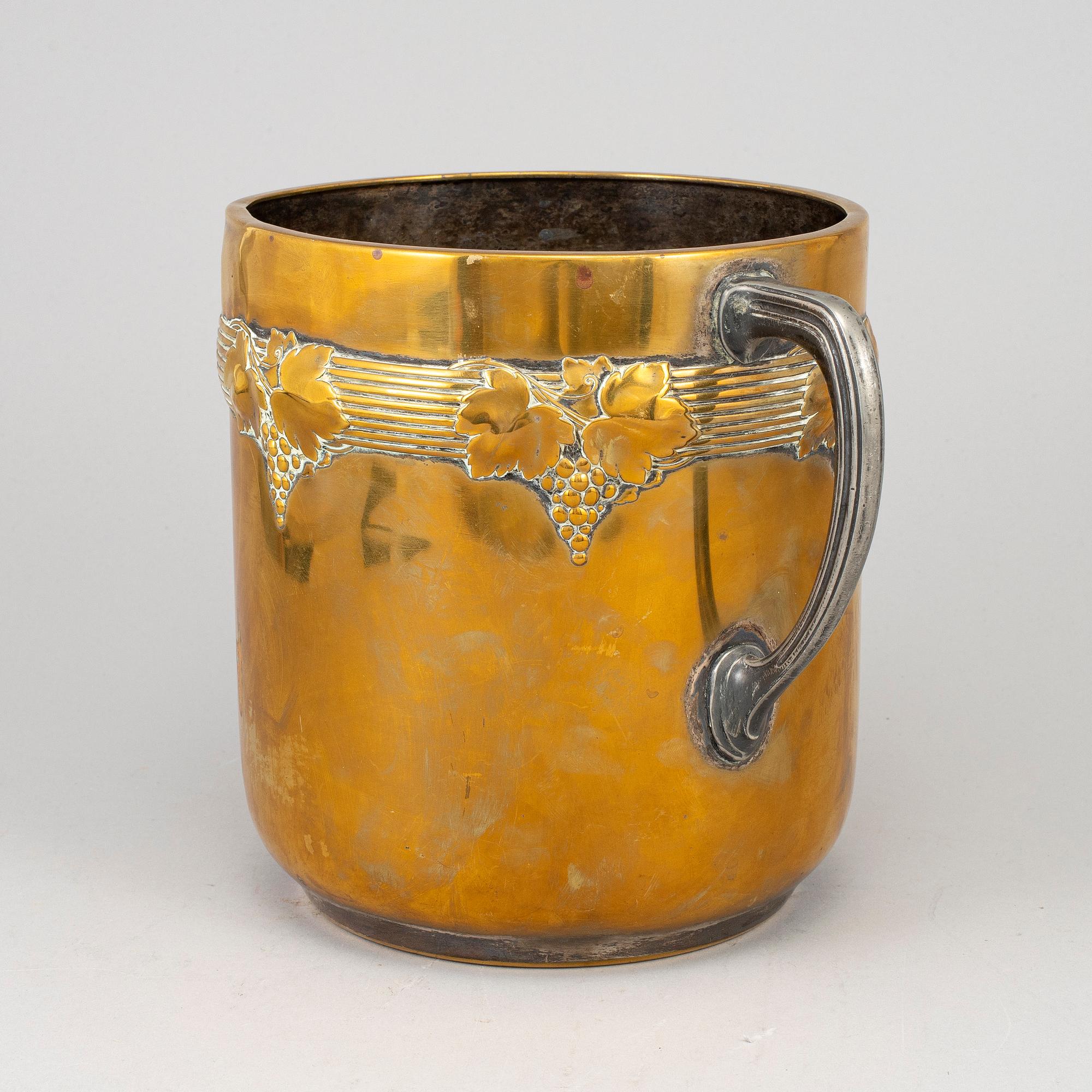 An art nouveau brass champagne cooler, early 20th century.