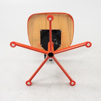 A red desk chair, 1970's.