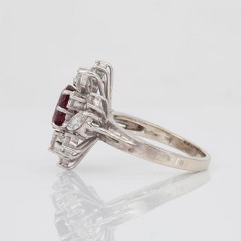 A circa 1.30 ct facetted ruby and marquise- and brilliant-cut diamond ring.