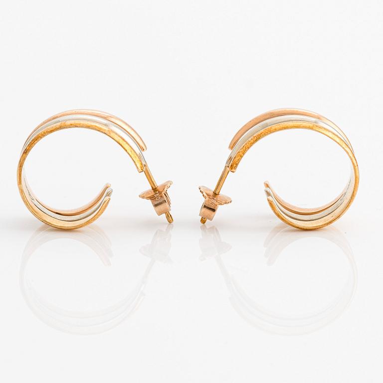 A pair of 18K gold Cartier earrings.