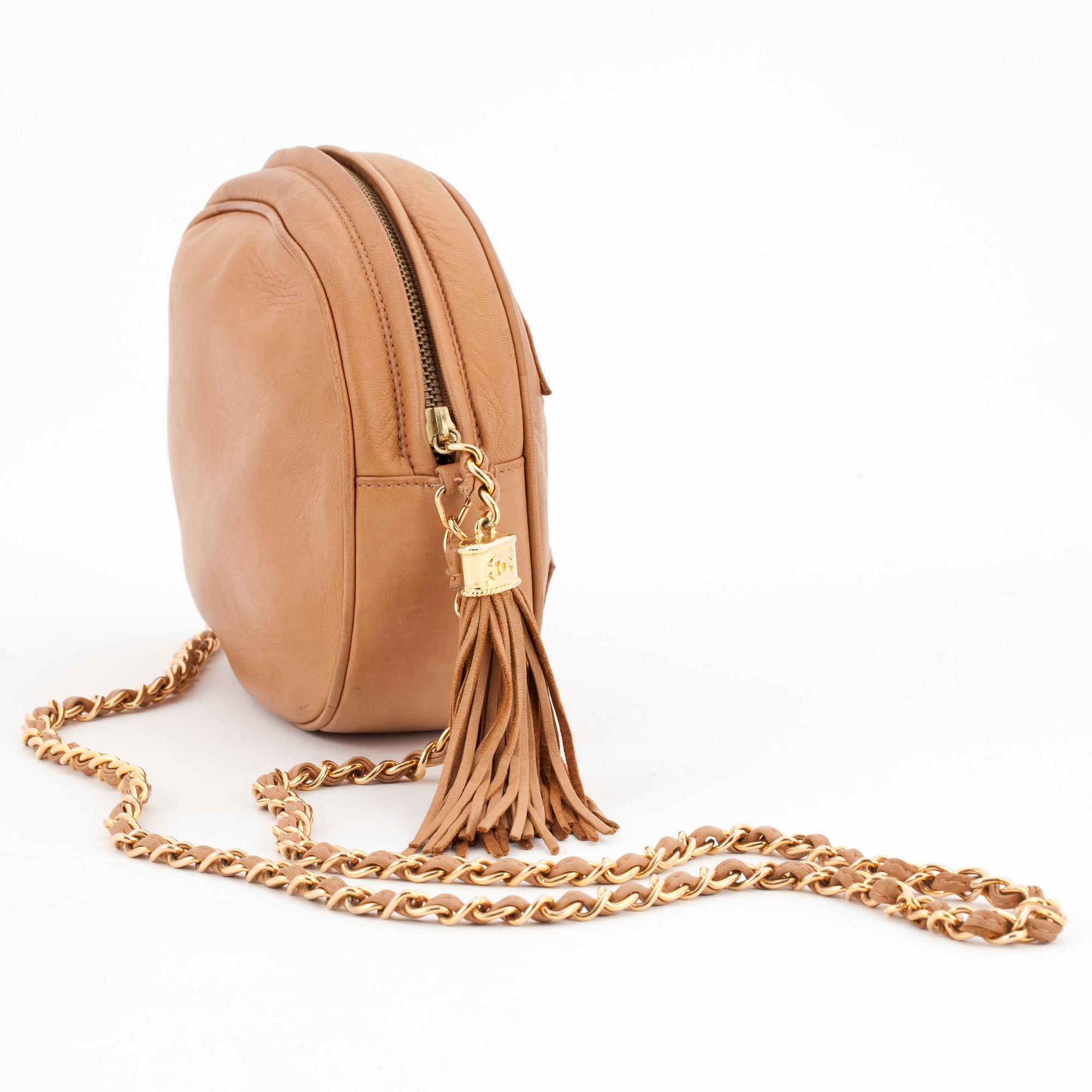 CHANEL, a beigebrown leather shoulder bag.