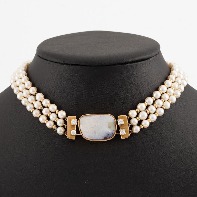 Necklace, three strands, cultured pearls clasp 14K gold with opal and round brilliant-cut diamonds.