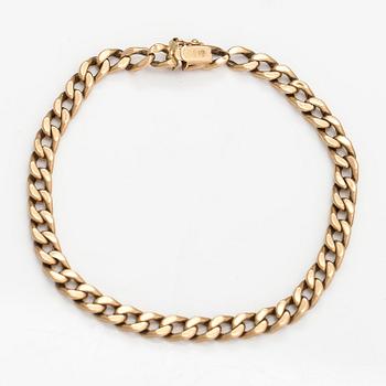 A 14K gold bracelet.