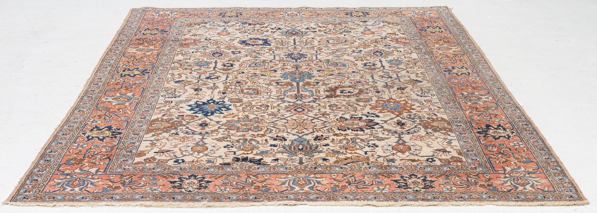 A semi antique Tabriz carpet, c. 290 x 195 cm.