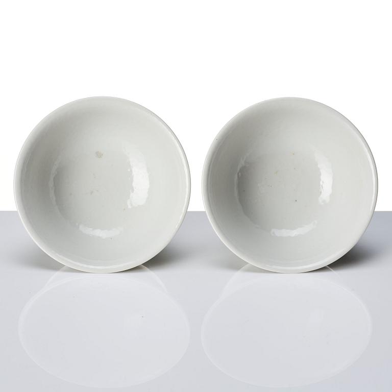 A pair of white glazed anhua stemcups, Qing dynasty, 19th Century.