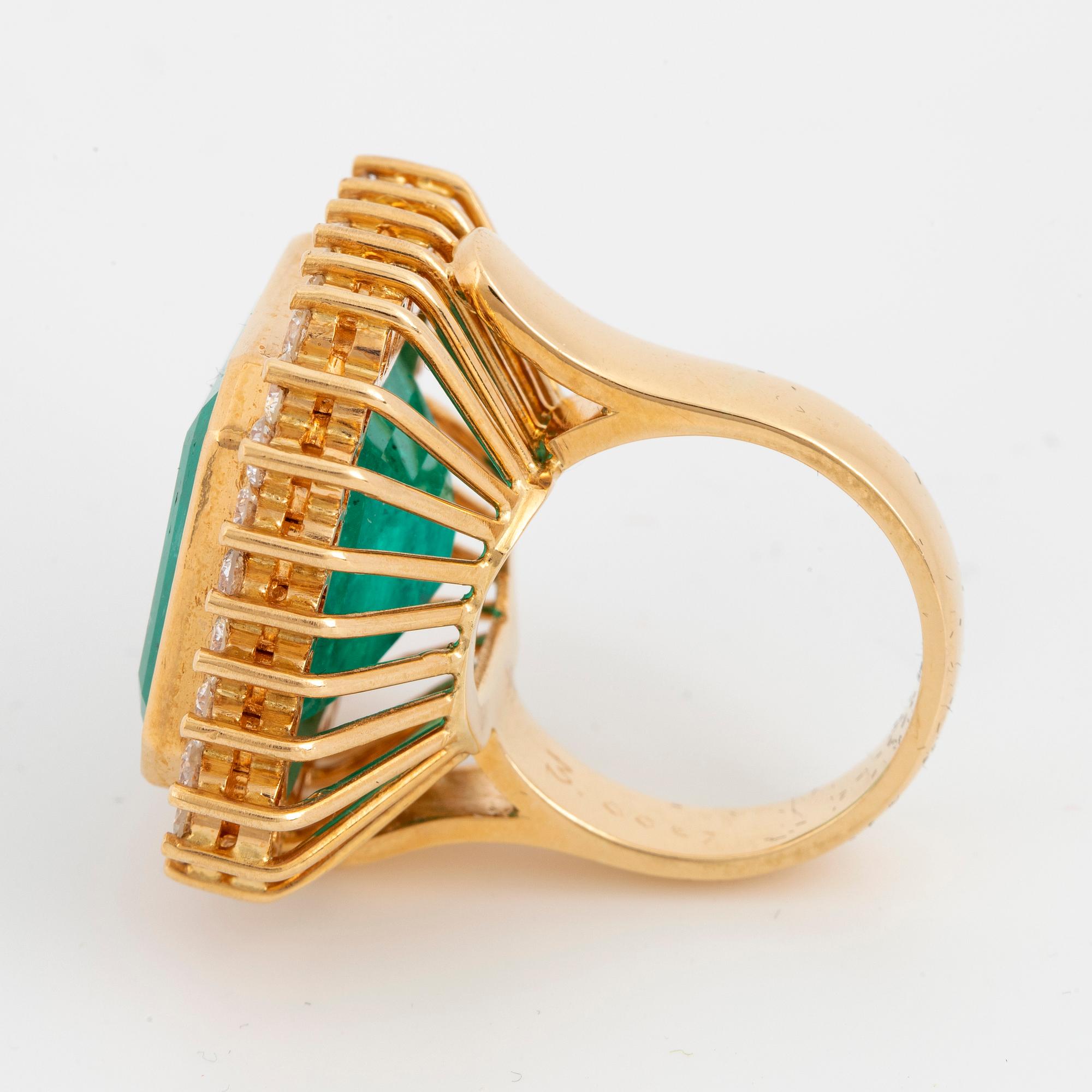 Large emerald-cut emerald and brilliant-cut diamond cocktail ring.