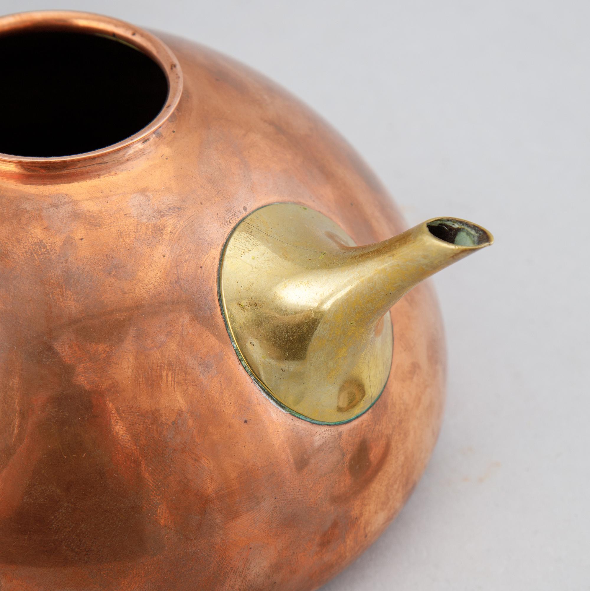 A copper, brass and rosewood teapot, Illums Bolighus, Denmark, 1950's.