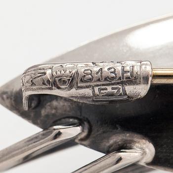 Elis Kauppi, Two silver brooches, one with a tiger's eye. Kupittaan kulta, Turku 1959 and 1962.