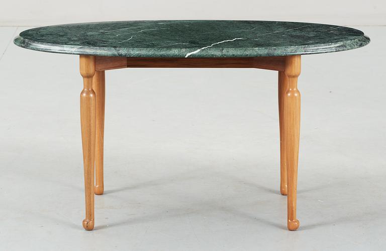 A Josef Frank green marble top table and mahogany by Svenskt Tenn.