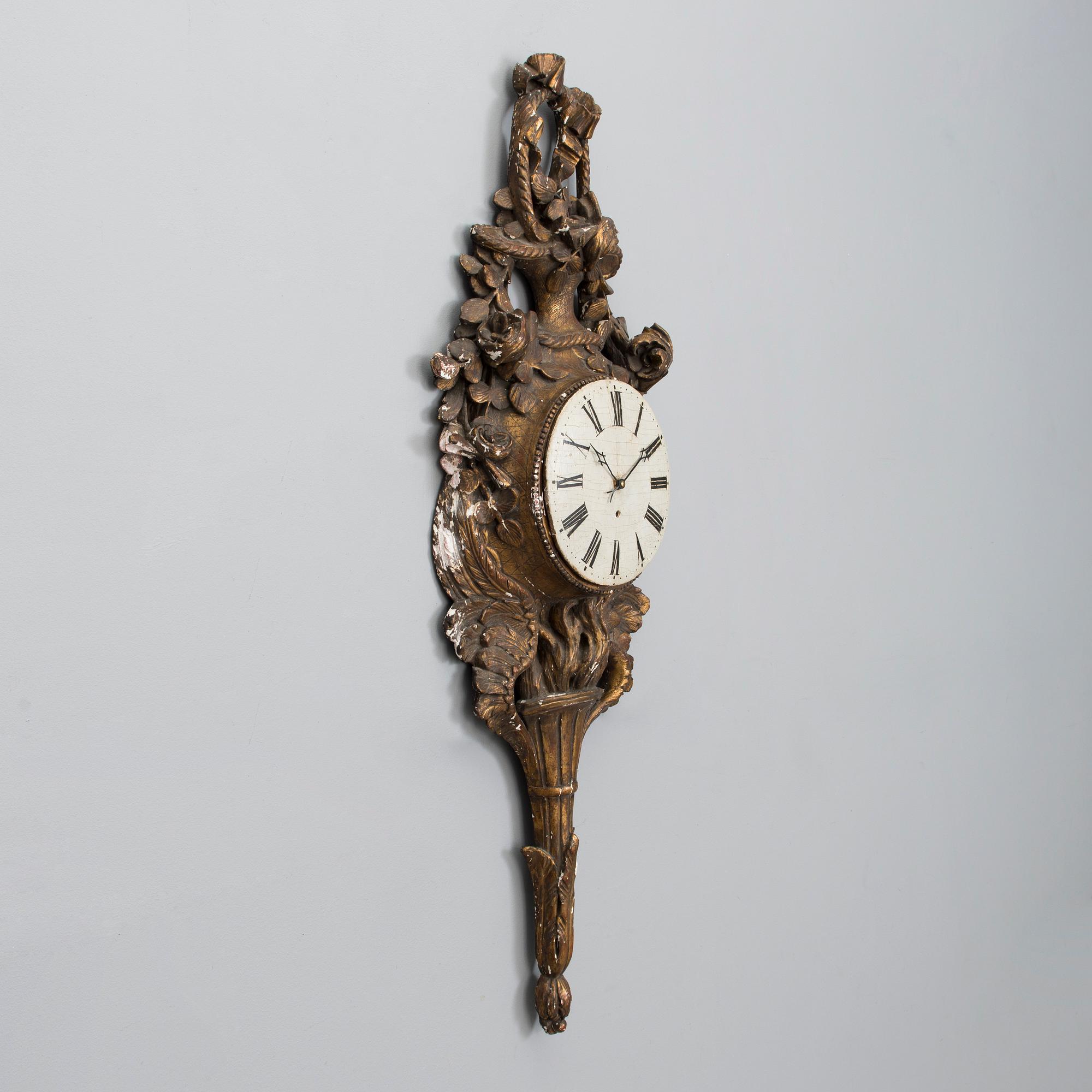 A 18th century wall clock.