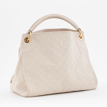 LOUIS VUITTON, a creme colored shoulder bag with embossed monogram print, "Artsy MM".