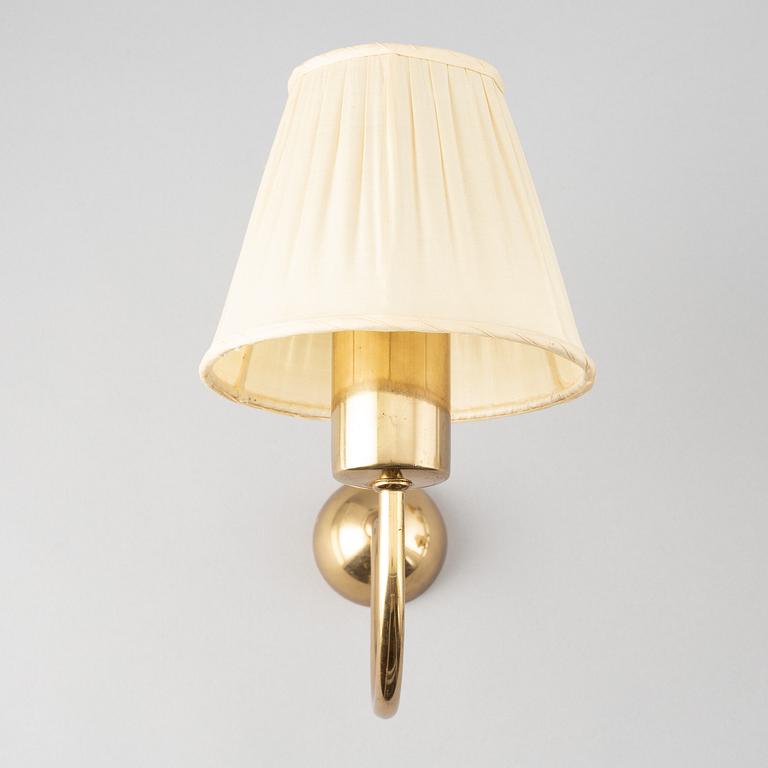 Three brass wall lamps, model 2335 and 2334, by Josef Frank, Firma Svenskt Tenn.