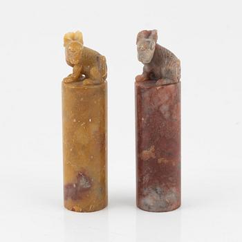 A set of four stone scholars objects and a enameled silver box with cover, Qing dynasty, circa 1900.