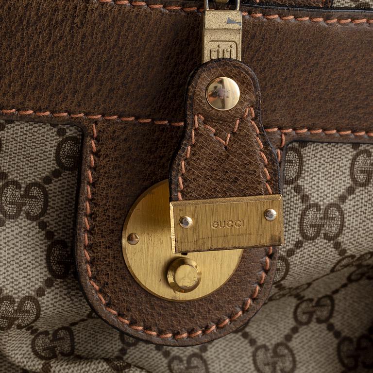 Gucci, a canvas weekend bag.