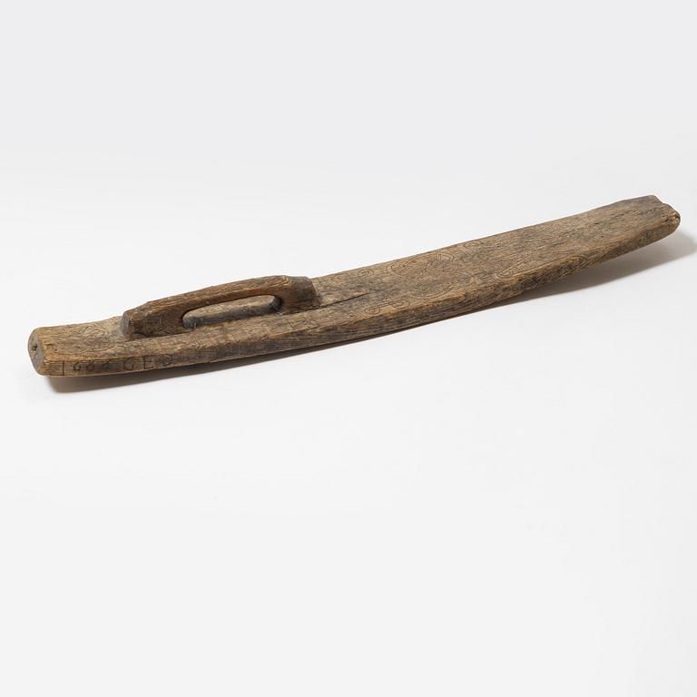 A Swedish folk art mangle board, dated 1666.