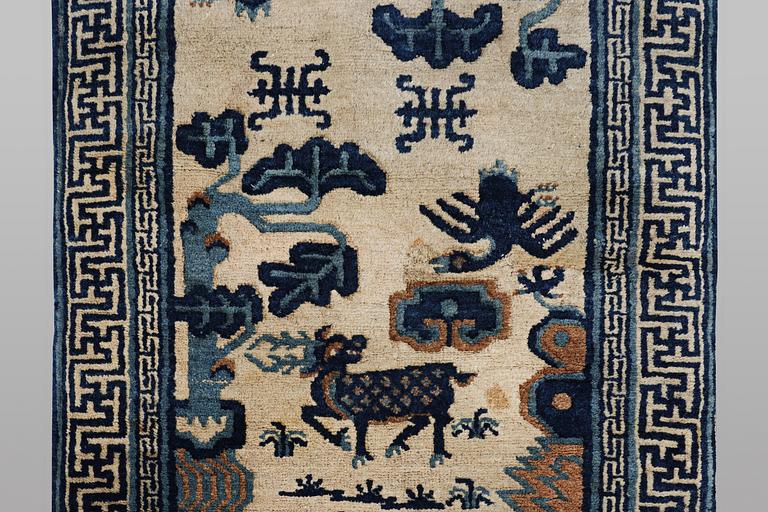 A rug, old, China, ca 125 x 60 cm.