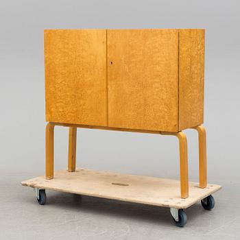 ALVAR AALTO, a mid 20th century burr birch veneered cabinet, model 810, Finland.