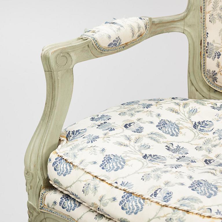 A pair of rococo-style open armchairs, 20th century.