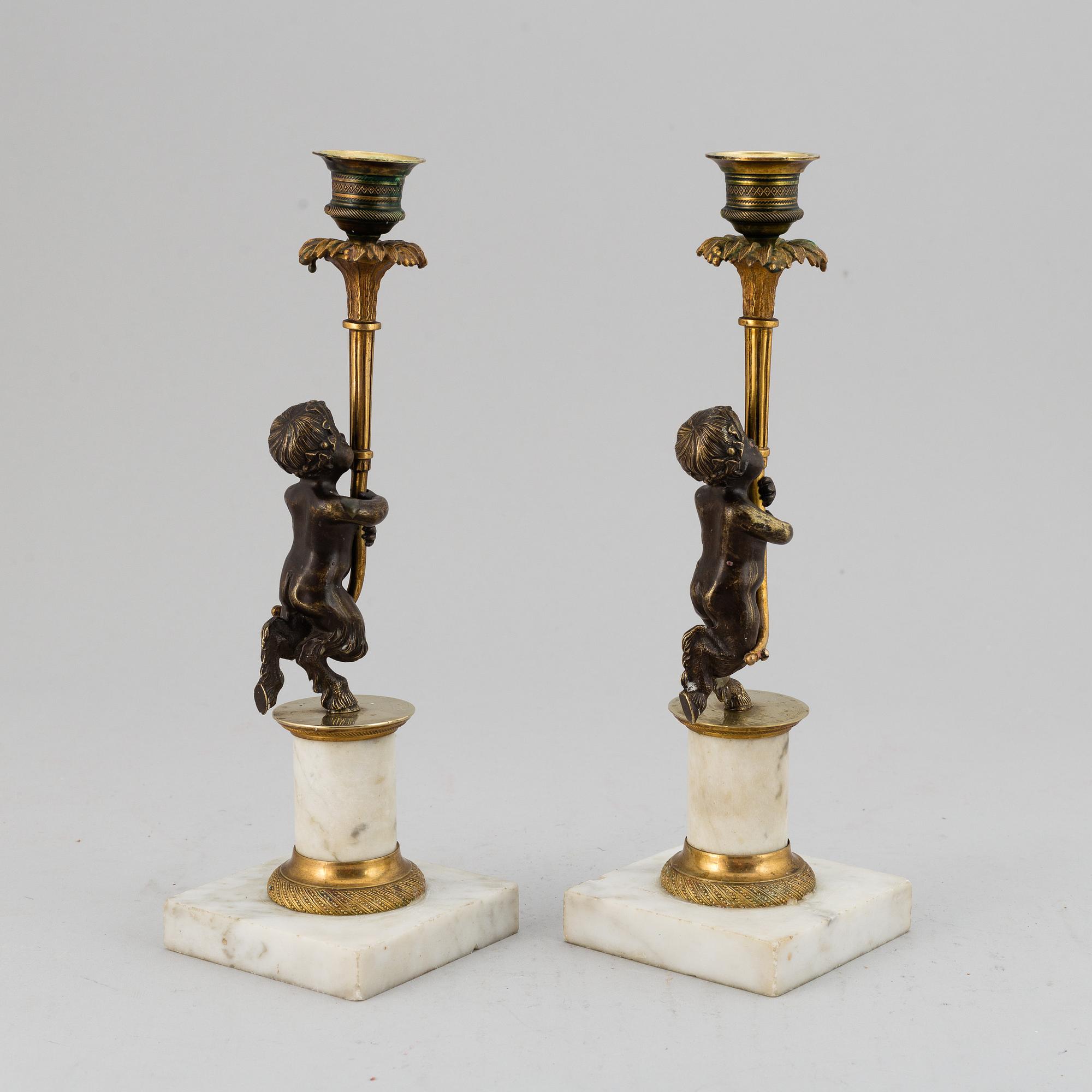 A pair of gustavian style candles sticks, circa 1900.