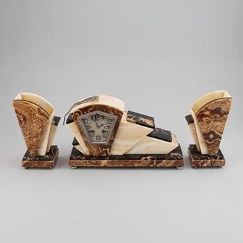 A three piece clock garniture, Art Deco style, 20th Century.